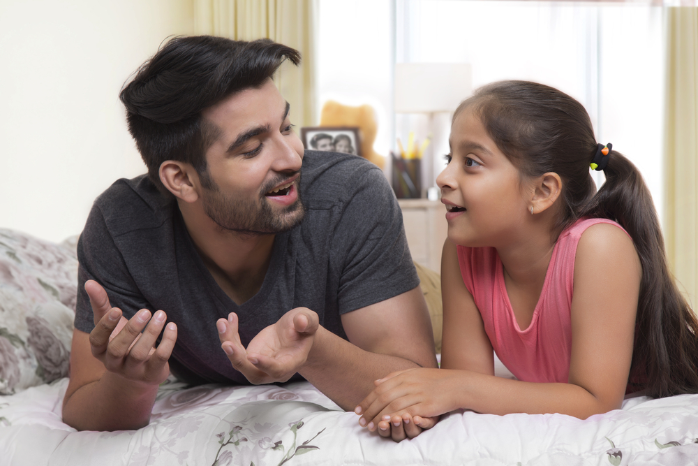 A Man and a Little Girl Talking to Each Other