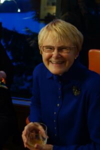 A Woman With Blond Hair in a Blue Color Jacket