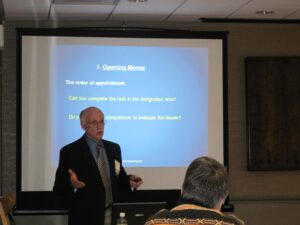 A Man Presenting to a Group of People